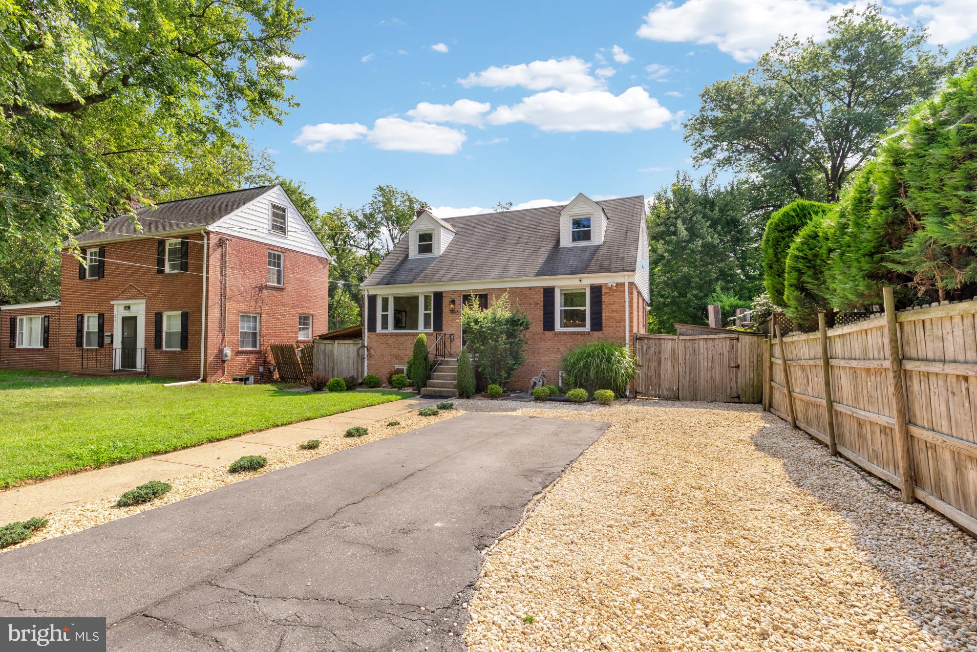 9811 Dallas Avenue Silver Spring, MD 20901 - Photo 4 of 45 a front view of a house with a yard and garage
