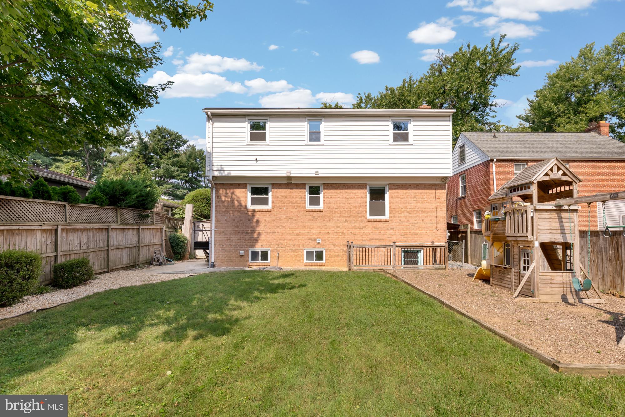 9811 Dallas Avenue Silver Spring, MD 20901 - Photo 44 of 45 a front view of a house with a yard and trees