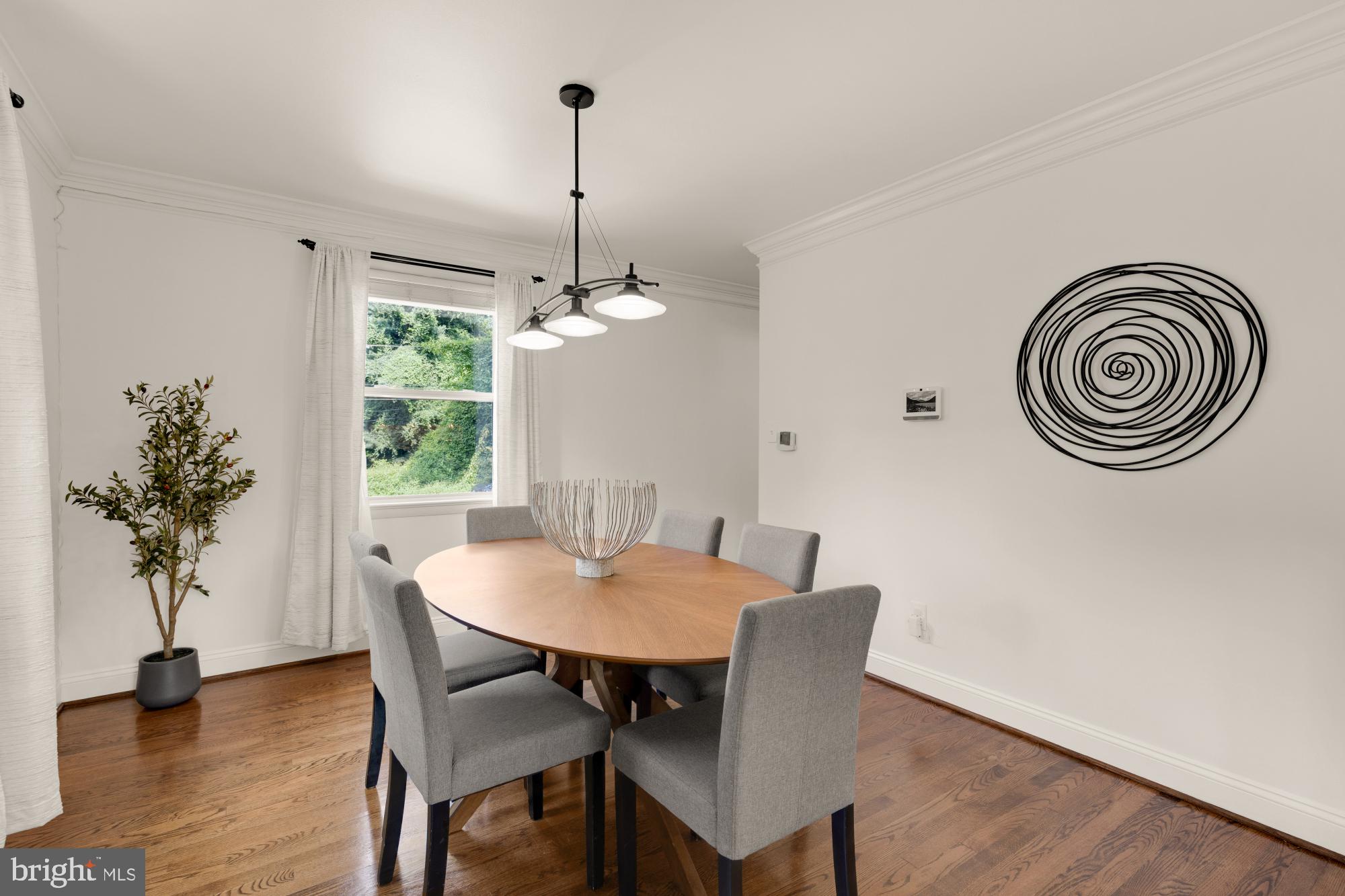 9811 Dallas Avenue Silver Spring, MD 20901 - Photo 8 of 45 a view of a dining room with furniture window and wooden floor