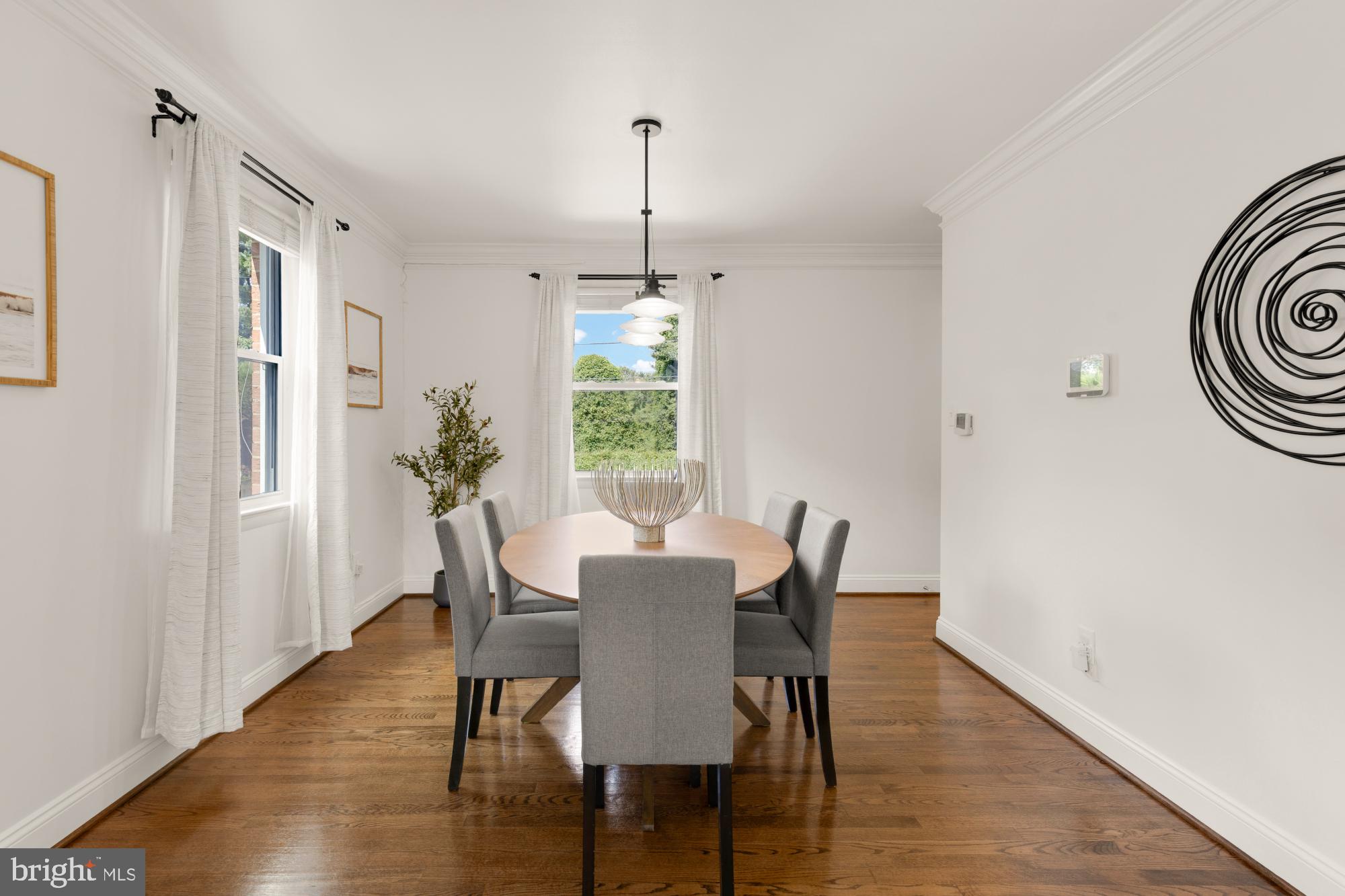 9811 Dallas Avenue Silver Spring, MD 20901 - Photo 9 of 45 a view of a dining room with furniture window and wooden floor