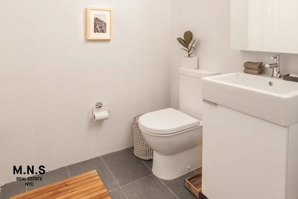 335 East 27th Street, Unit 9A Manhattan, NY 10016 - Photo 8 of 11 a bathroom with a toilet and a sink