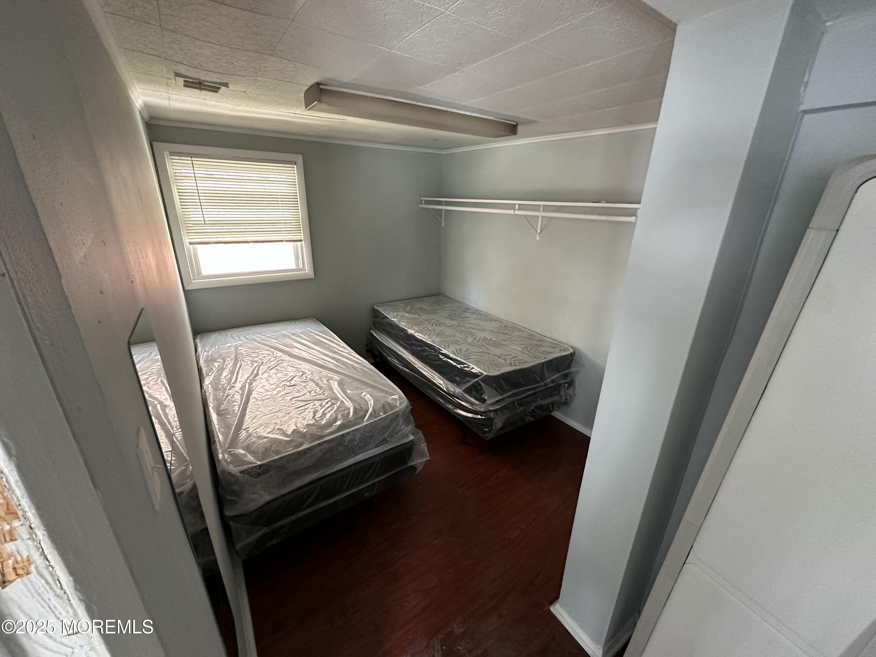 116 12th Avenue, Unit B Belmar, NJ 07719 - Photo 3 of 5 a bedroom with bed and a window