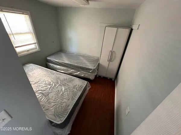 a view of front door with wooden floor