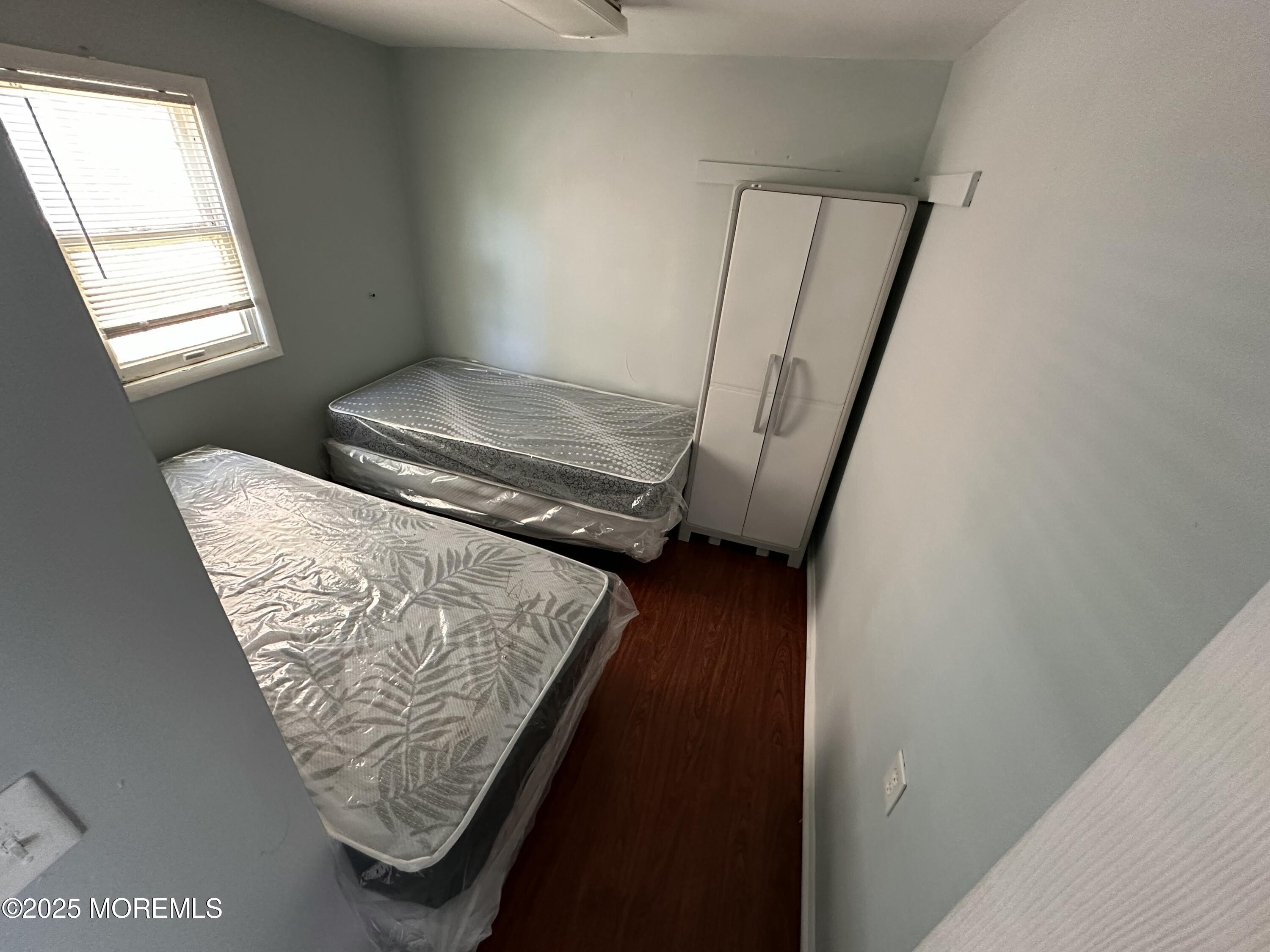 116 12th Avenue, Unit B Belmar, NJ 07719 - Photo 4 of 5 a view of front door with wooden floor