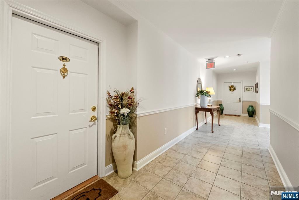 108 The Promenade, Unit 108 Edgewater, NJ 07020 - Photo 40 of 49 a view of a room with gym equipment