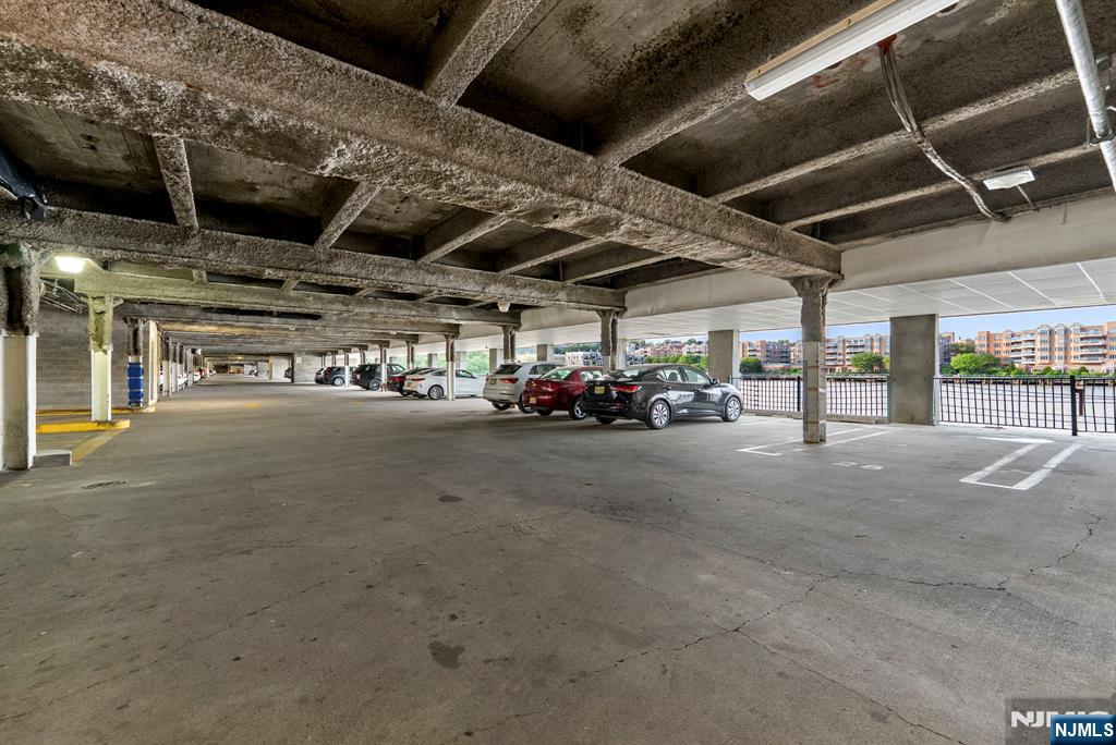 108 The Promenade, Unit 108 Edgewater, NJ 07020 - Photo 49 of 49 a view of garage with of car