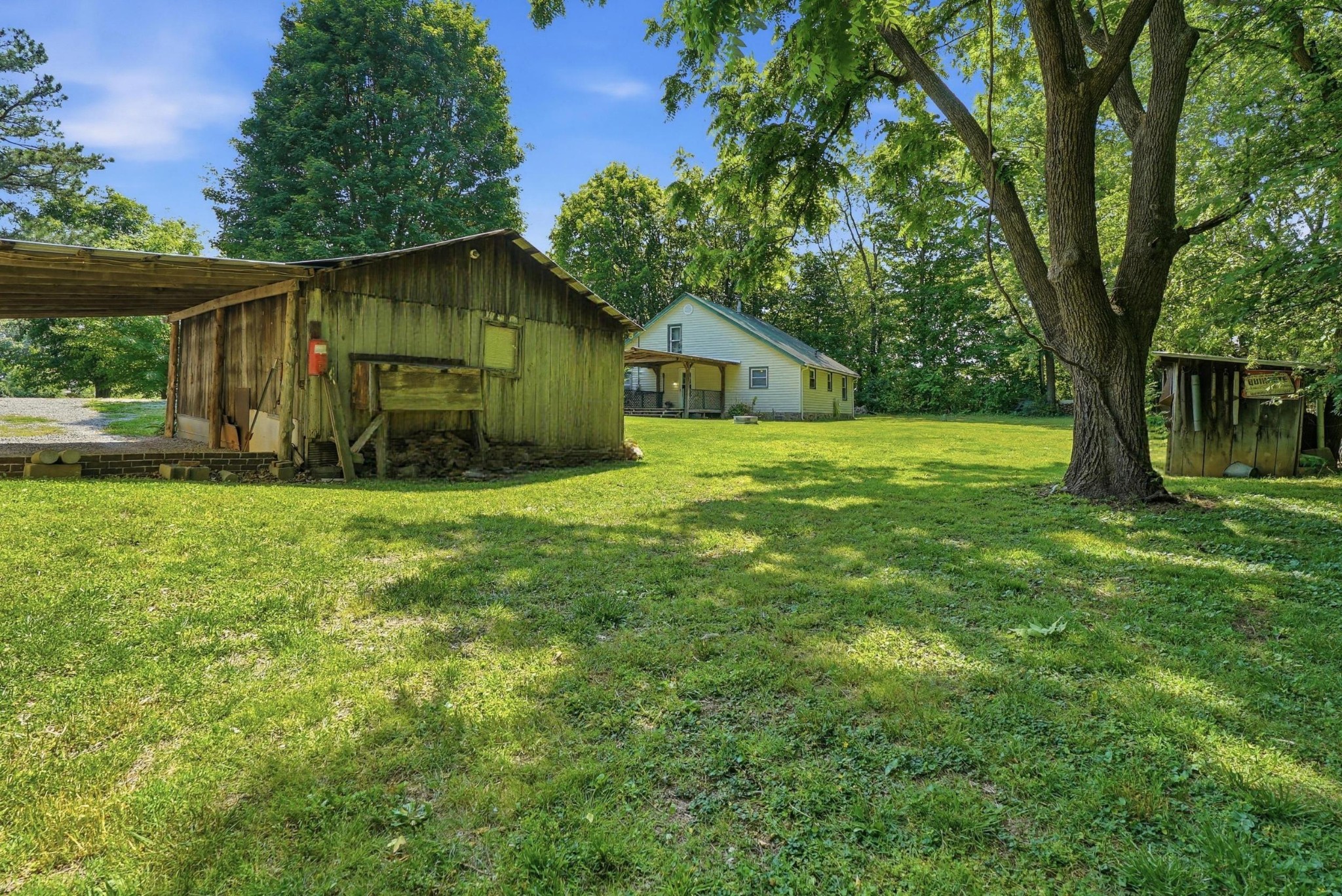 6471 Highway 161 Springfield, TN 37172 - Photo 44 of 57 a yellow house in middle of the forest