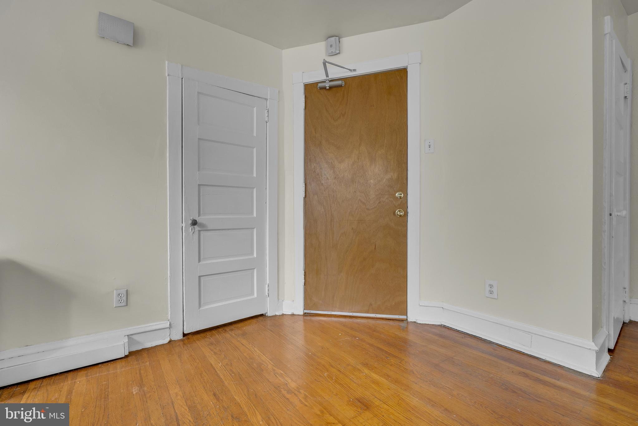 5121 East Roosevelt Boulevard, Unit 2 Philadelphia, PA 19124 - Photo 11 of 23 an empty room with wooden floor and closet