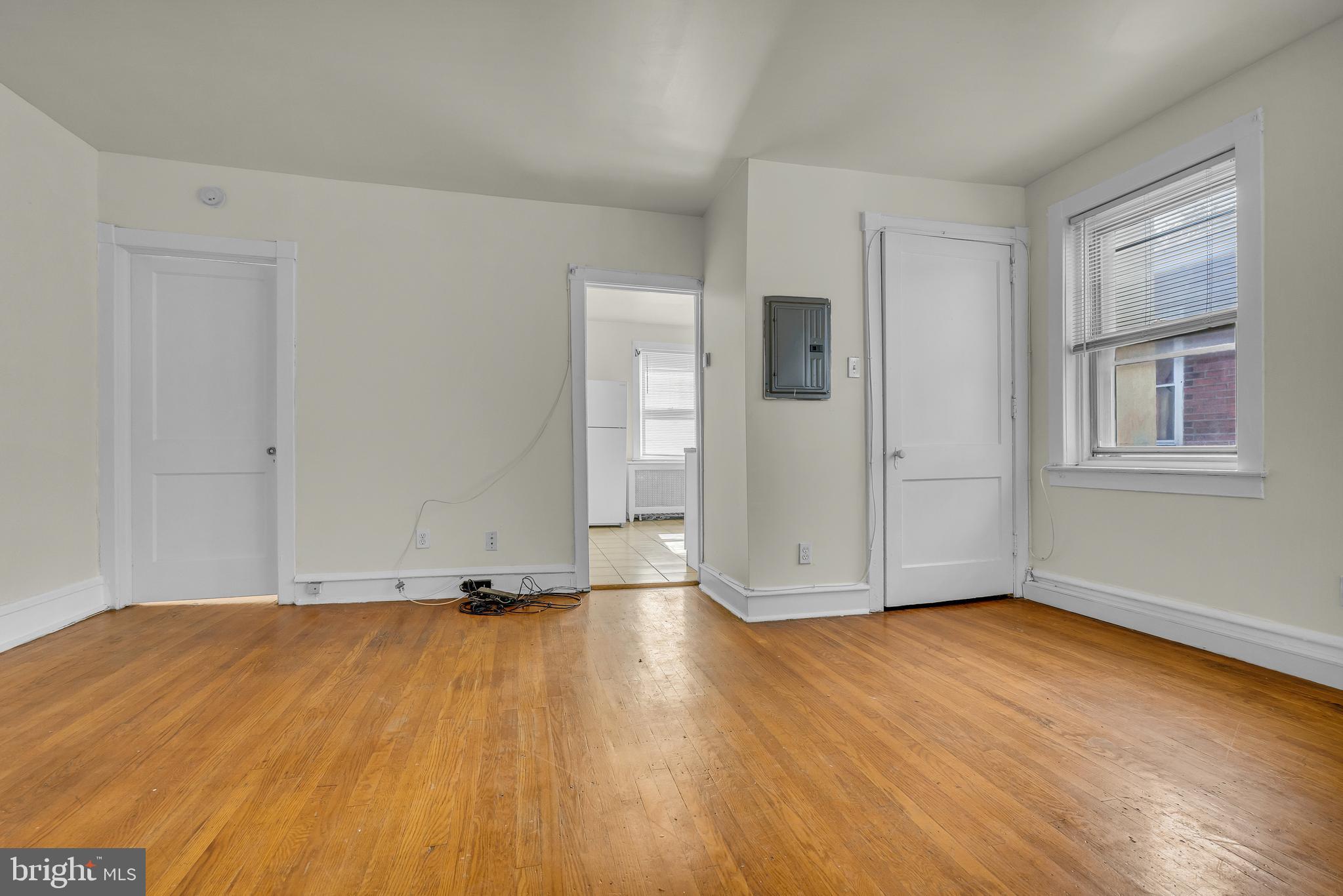 5121 East Roosevelt Boulevard, Unit 2 Philadelphia, PA 19124 - Photo 12 of 23 a view of a room with wooden floor and window