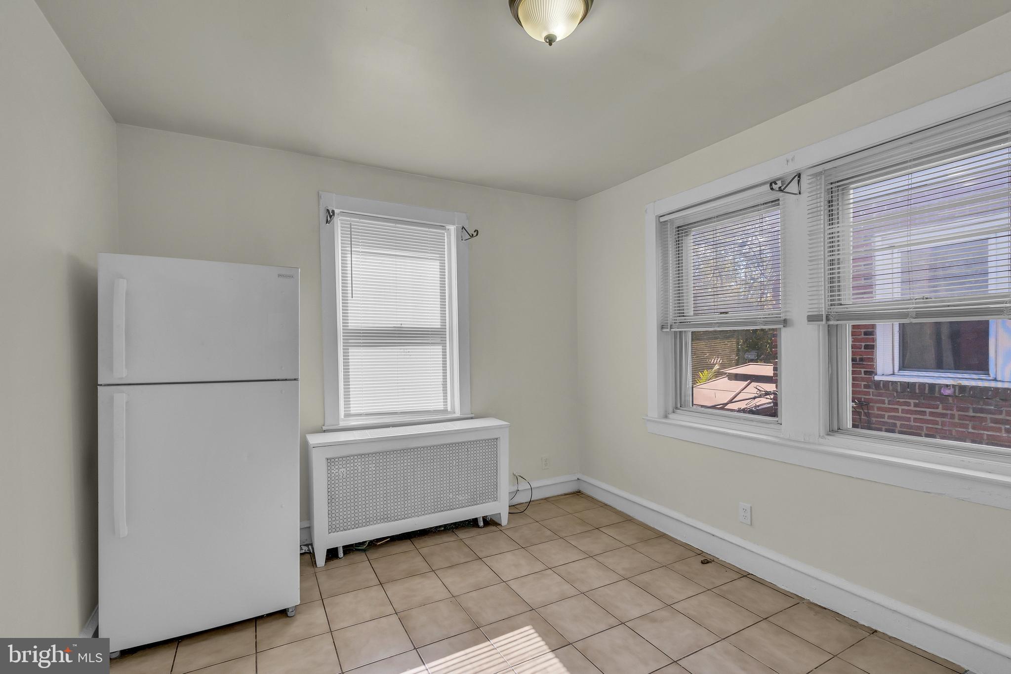 5121 East Roosevelt Boulevard, Unit 2 Philadelphia, PA 19124 - Photo 4 of 23 a view of an empty room with a window