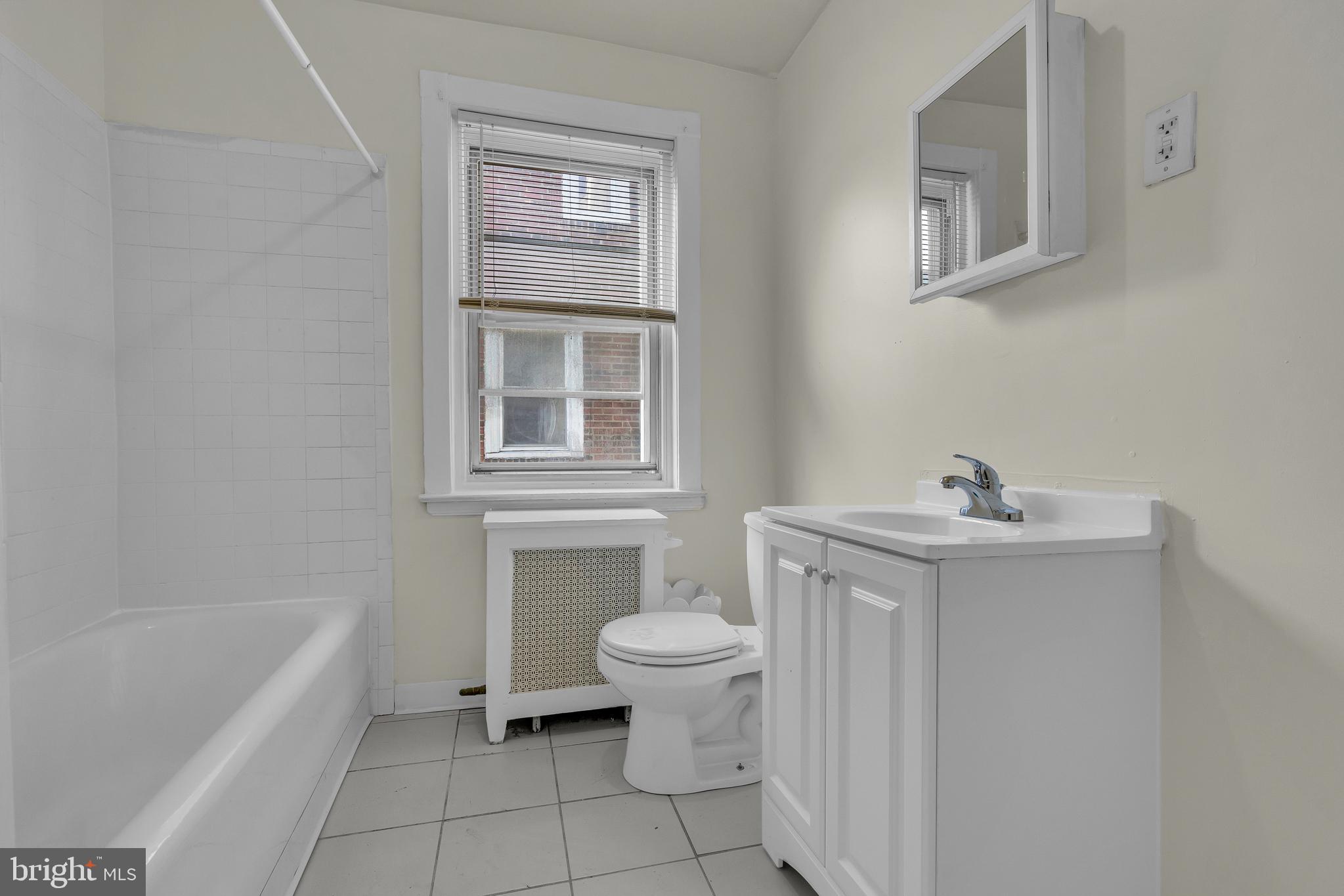 5121 East Roosevelt Boulevard, Unit 2 Philadelphia, PA 19124 - Photo 5 of 23 a bathroom with a sink toilet and bathtub