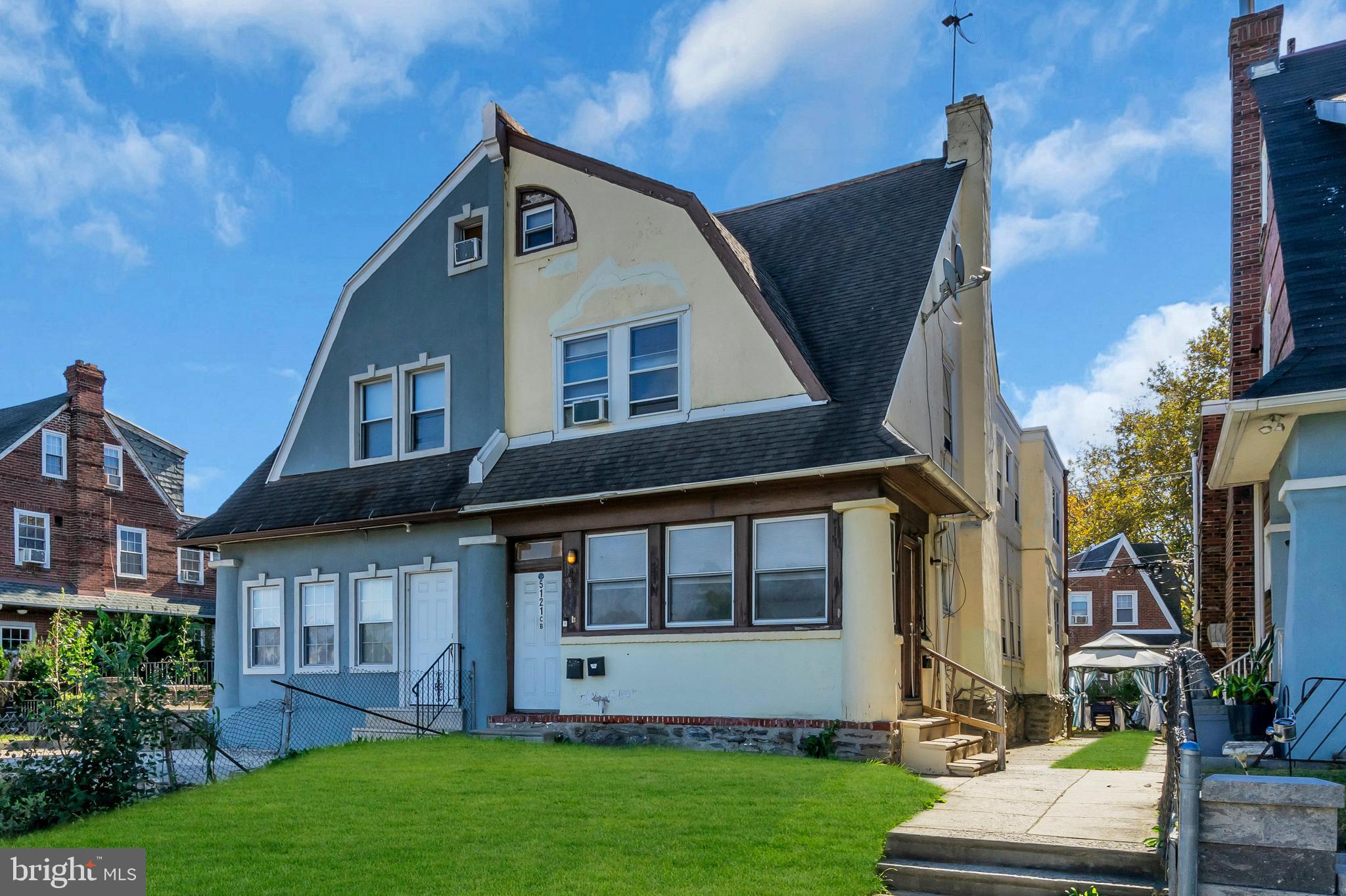 5121 East Roosevelt Boulevard, Unit 2 Philadelphia, PA 19124 - Photo 6 of 23 a front view of a house with a yard