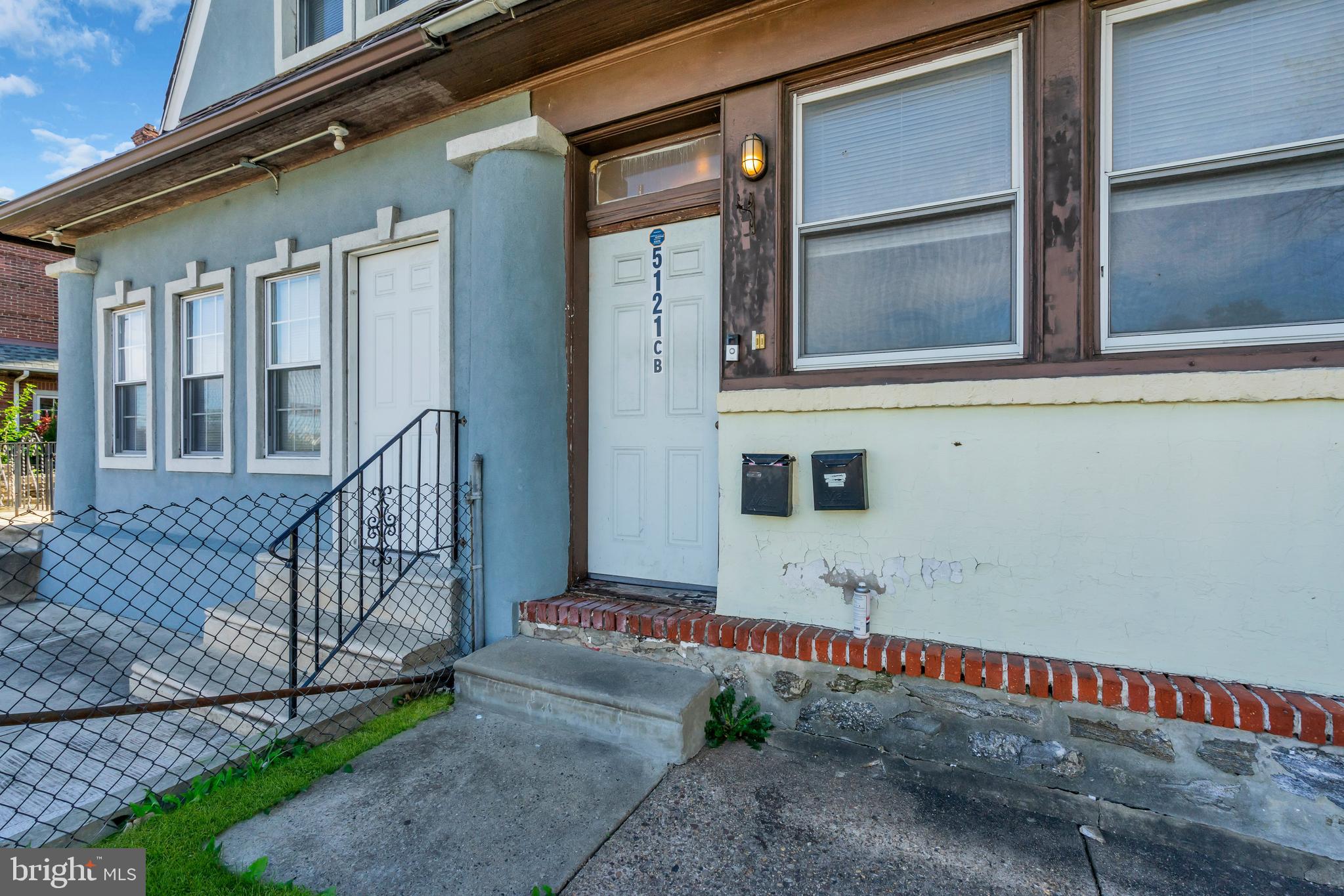 5121 East Roosevelt Boulevard, Unit 2 Philadelphia, PA 19124 - Photo 7 of 23 a front view of a house with a yard