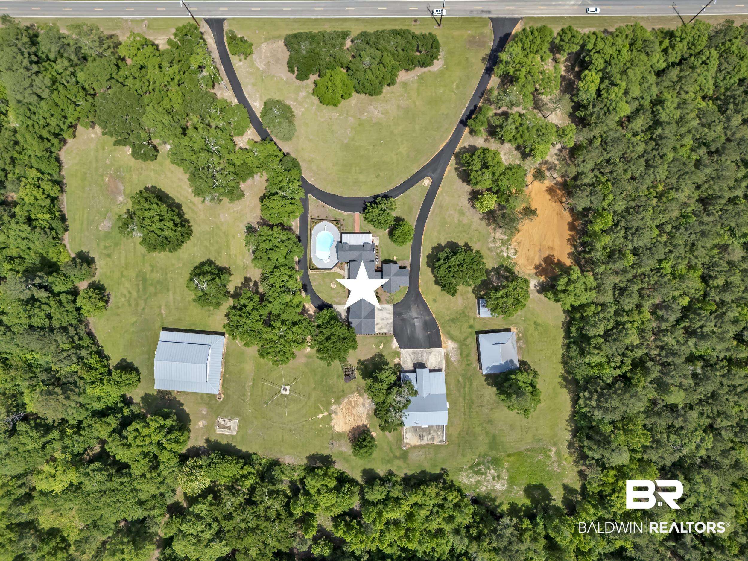 43199 Pine Grove Road Bay Minette, AL 36507 - Photo 28 of 71 Expansive property with multiple structures, including a primary residence, two outbuildings, and a large barn