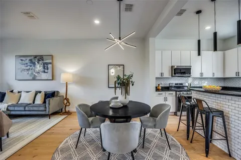 a dining room with furniture and window