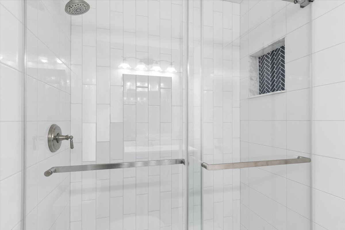 1733 Harrow Court, Unit B Wheaton, IL 60189 - Photo 12 of 23 a bathroom with a shower
