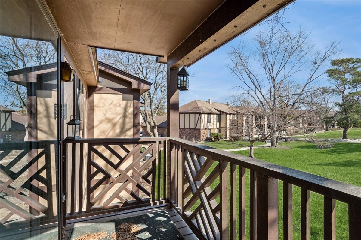 1733 Harrow Court, Unit B Wheaton, IL 60189 - Photo 21 of 23 a view of a balcony with wooden floor