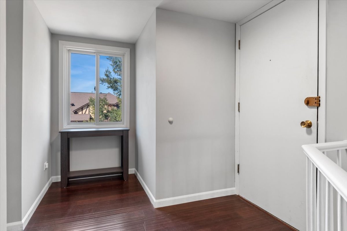 1733 Harrow Court, Unit B Wheaton, IL 60189 - Photo 9 of 23 a view of an entryway with wooden floor