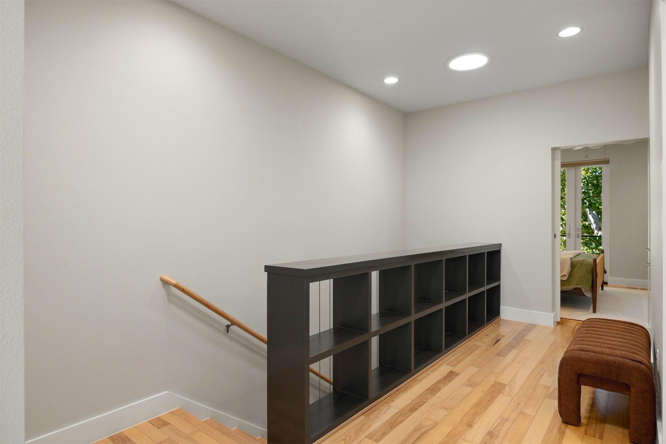 3921 Threadgill Street Austin, TX 78723 - Photo 21 of 36 The bright upstairs hallway creates a smooth transition between the private bedrooms and the open flexible spaces on the upper floor