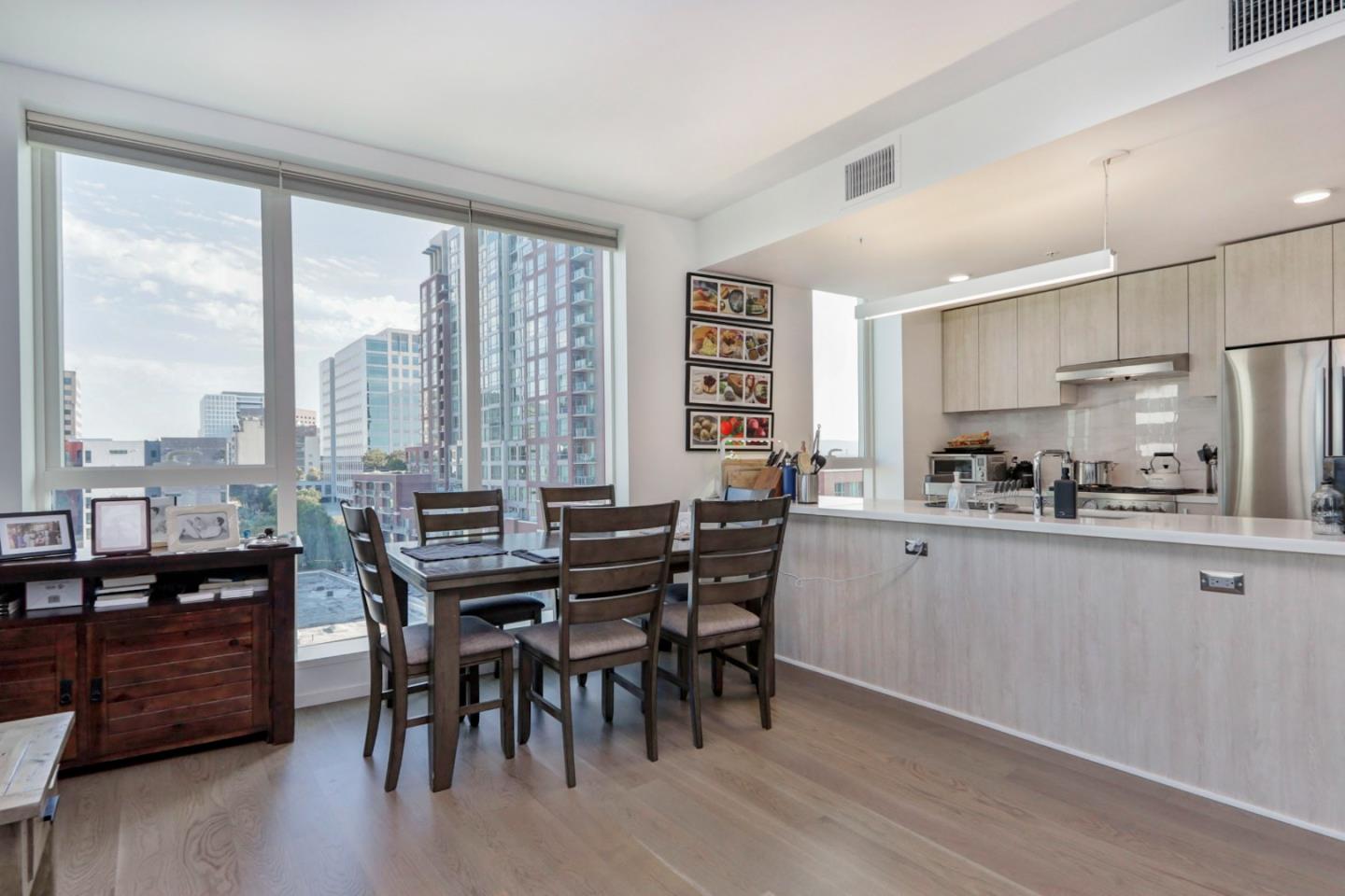 188 West St James Street, Unit 10819 San Jose, CA 95110 - Photo 11 of 41 a view of a dining room with furniture window and wooden floor