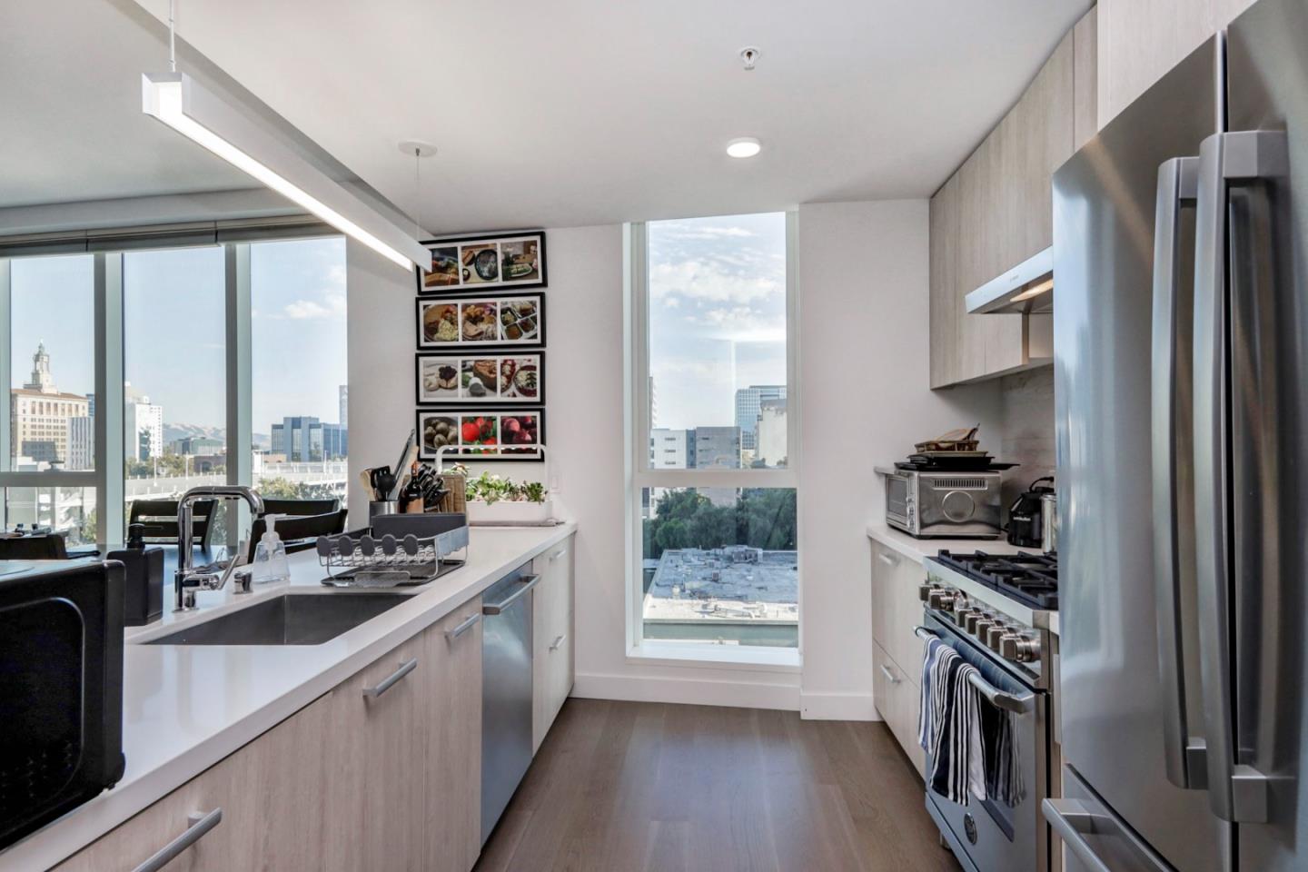 188 West St James Street, Unit 10819 San Jose, CA 95110 - Photo 14 of 41 a kitchen with stainless steel appliances a sink a stove and a refrigerator