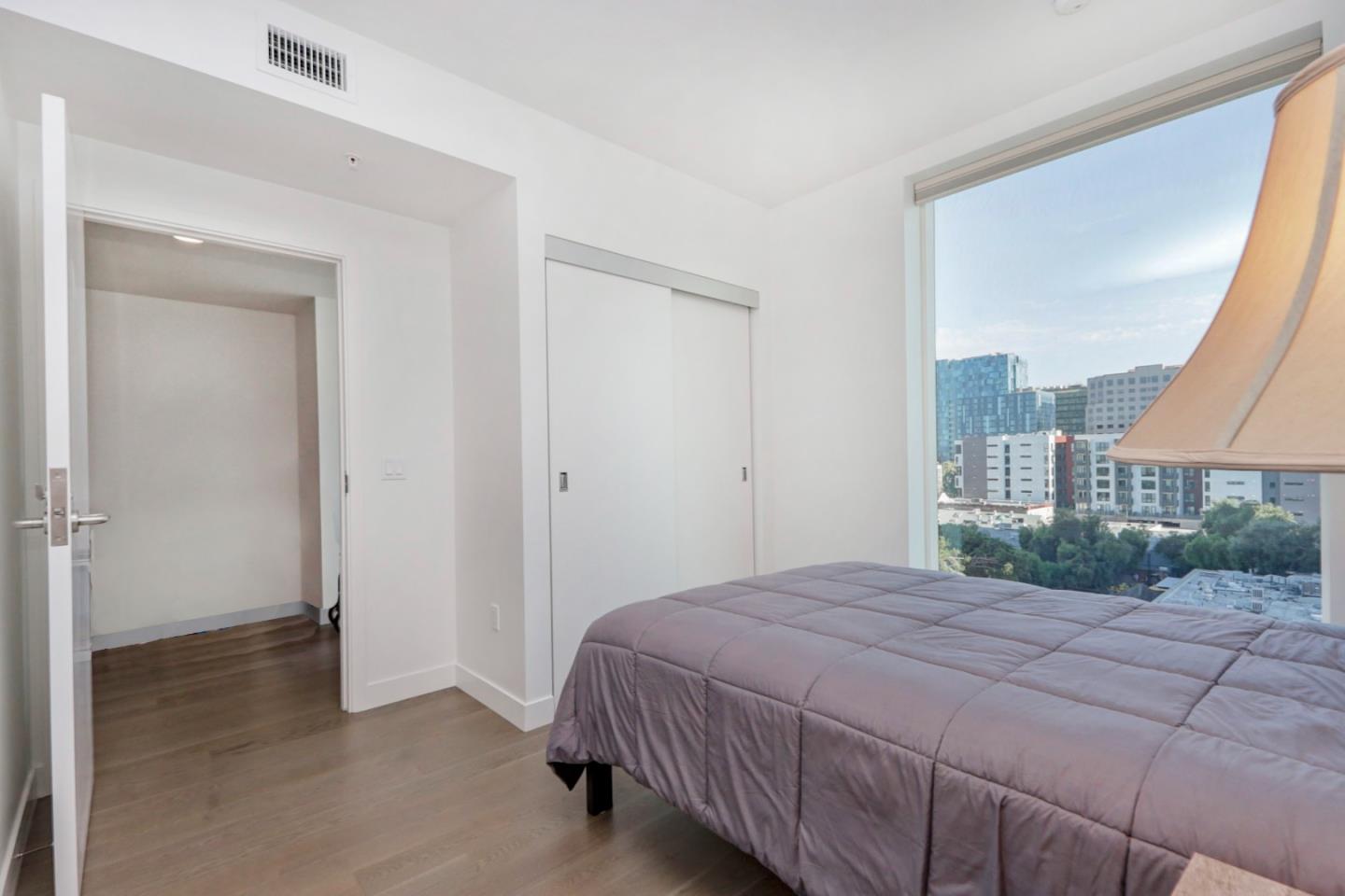 188 West St James Street, Unit 10819 San Jose, CA 95110 - Photo 16 of 41 a bedroom with a bed and a window