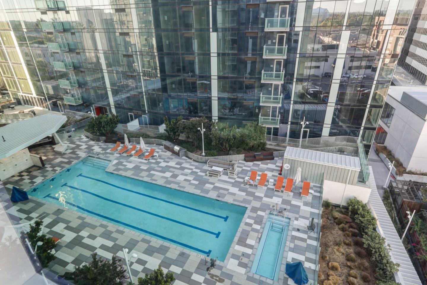 188 West St James Street, Unit 10819 San Jose, CA 95110 - Photo 21 of 41 a view of a garden with a bench in front of house