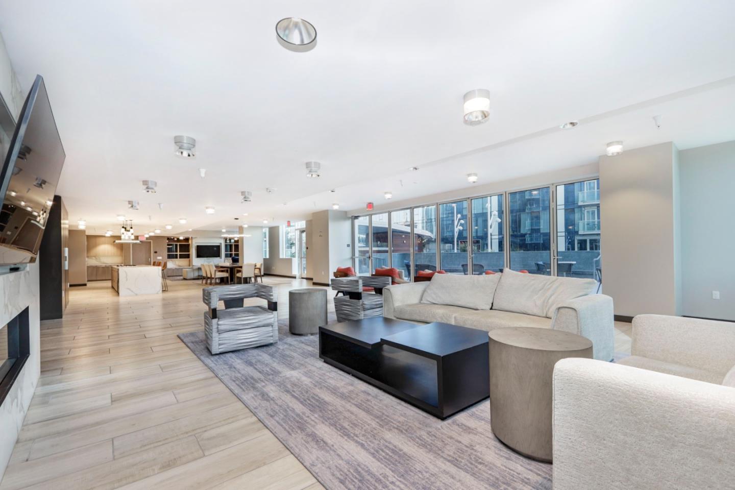 188 West St James Street, Unit 10819 San Jose, CA 95110 - Photo 24 of 41 a living room with furniture kitchen view and a large window