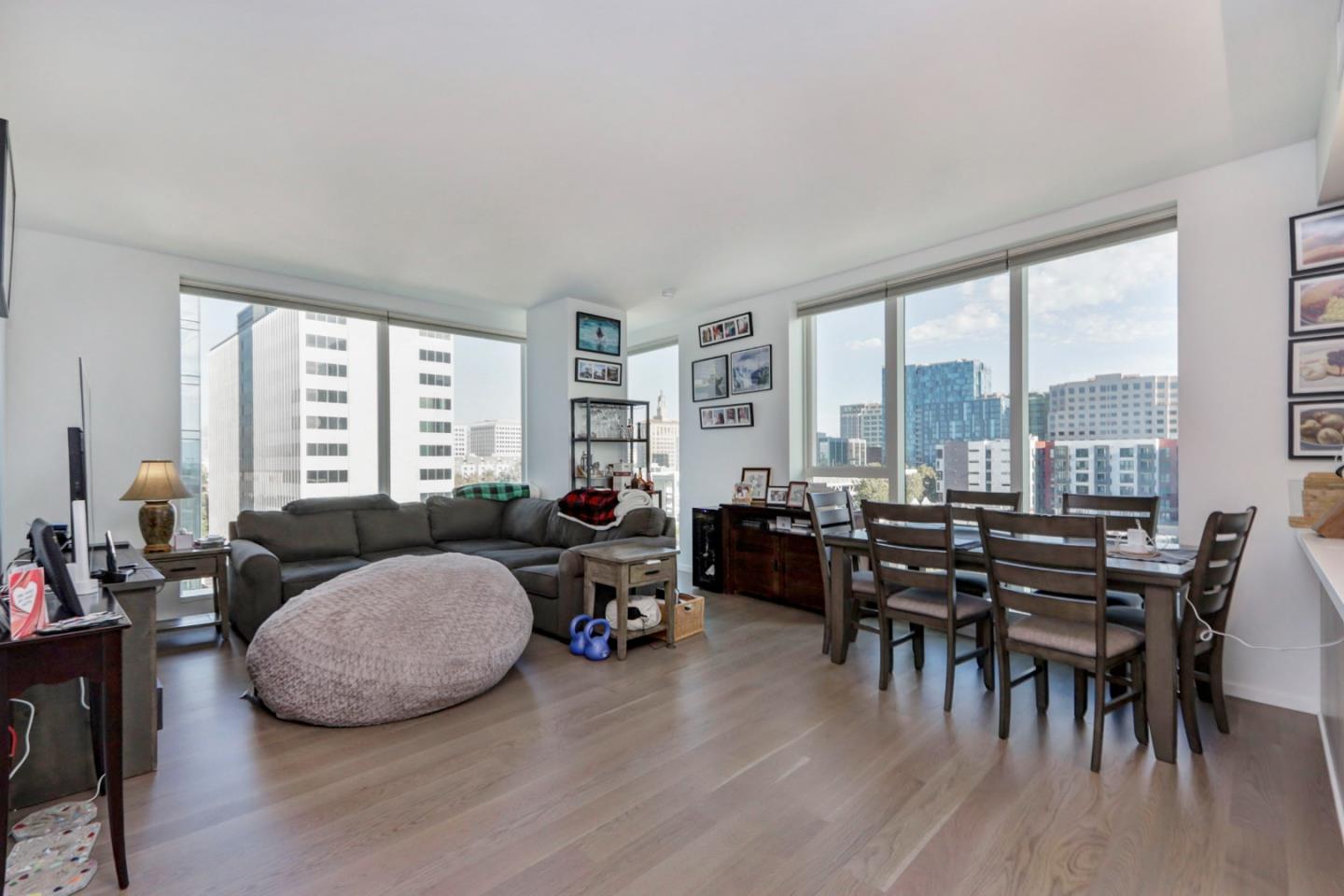 188 West St James Street, Unit 10819 San Jose, CA 95110 - Photo 6 of 41 a living room with furniture and a floor to ceiling window