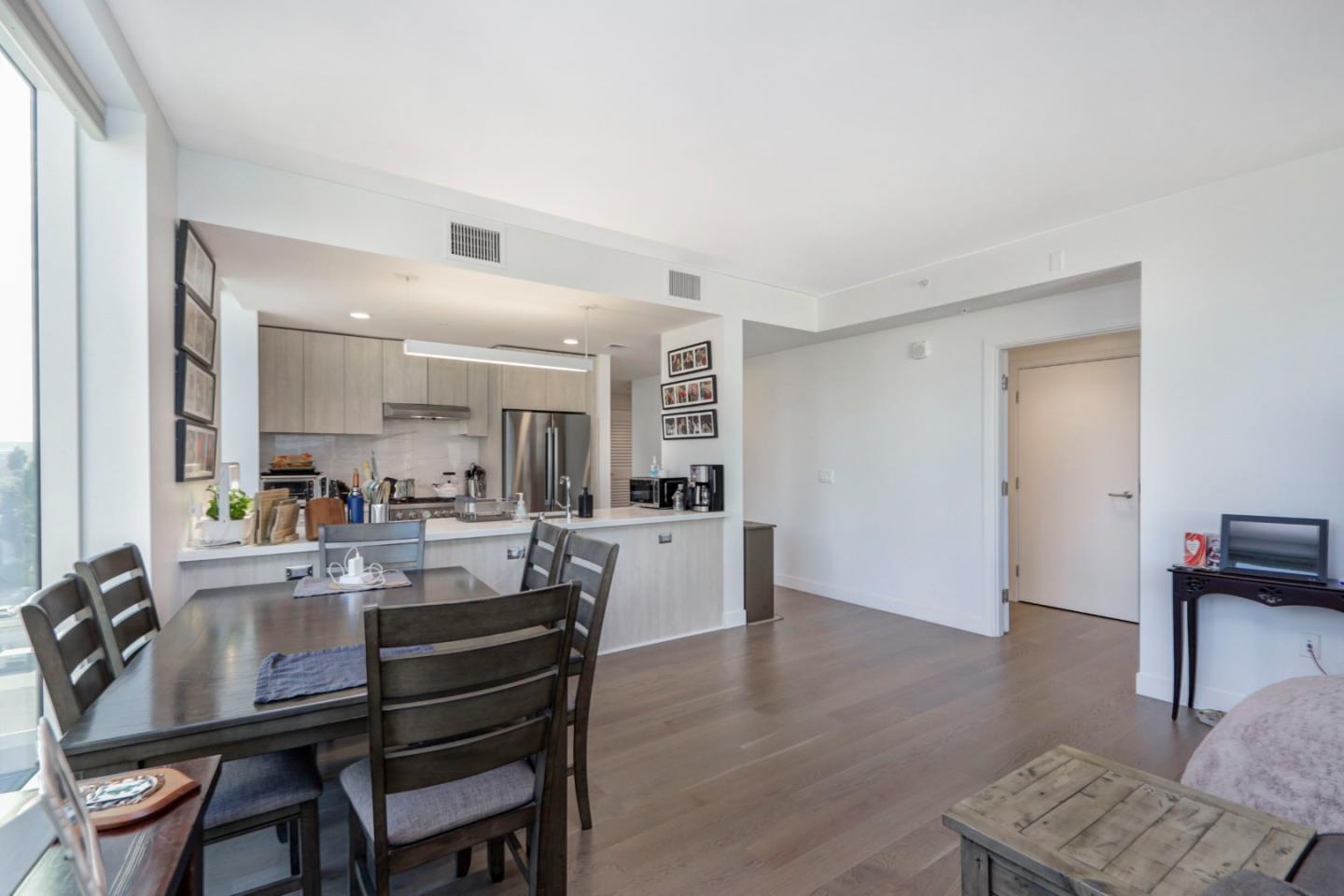 188 West St James Street, Unit 10819 San Jose, CA 95110 - Photo 7 of 41 a dining room with furniture and wooden floor