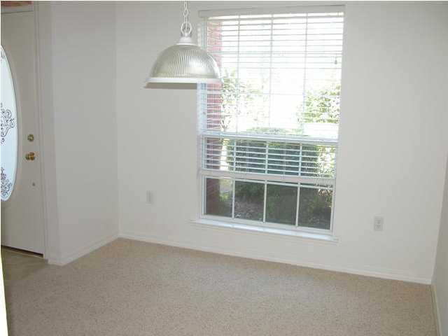 3892 Mesa Road Destin, FL 32541 - Photo 3 of 12 a view of an empty room with a window