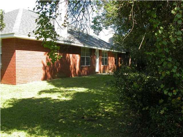 3892 Mesa Road Destin, FL 32541 - Photo 8 of 12 a view of a house with a yard