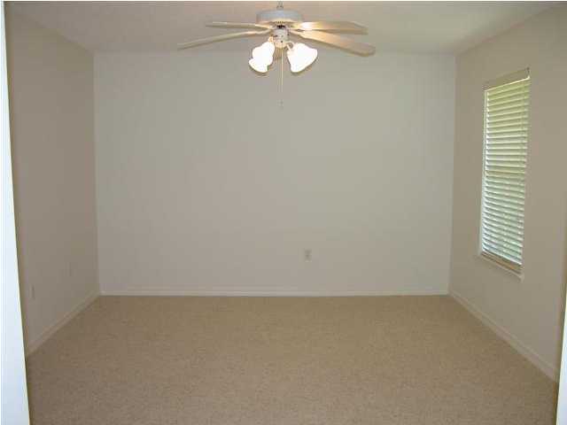 3892 Mesa Road Destin, FL 32541 - Photo 9 of 12 an empty room with a window