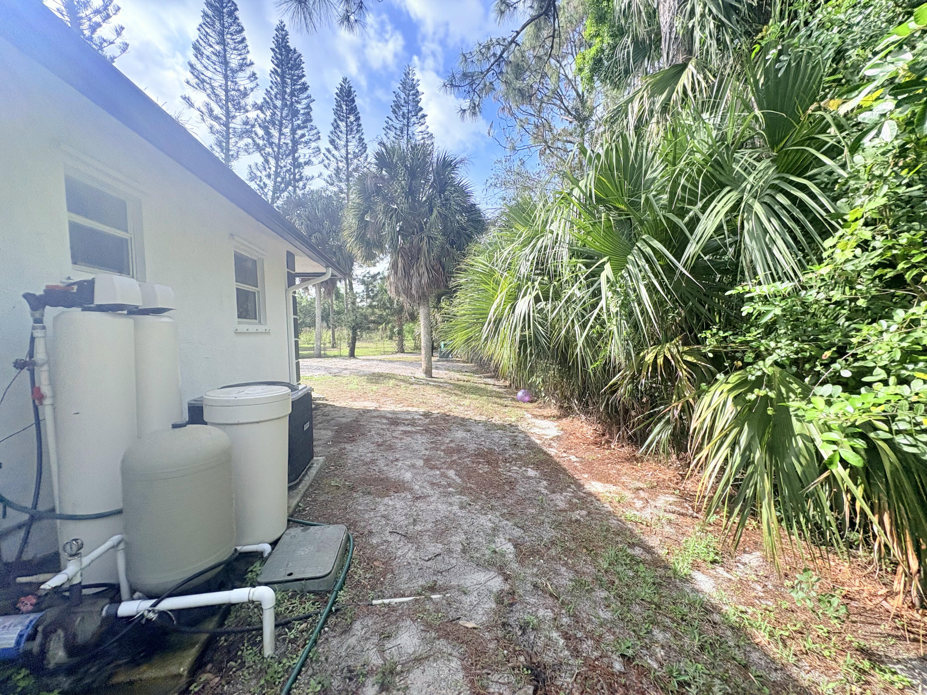 14523 Flamingo Road Loxahatchee Groves, FL 33470 - Photo 20 of 50 a view of a back yard from a house