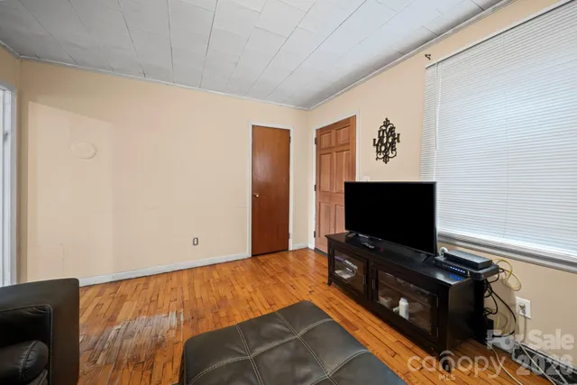 a room with furniture and flat screen tv