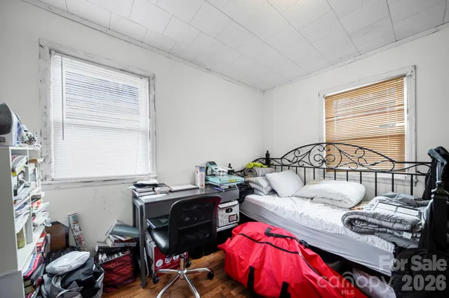 a bedroom with furniture and a window