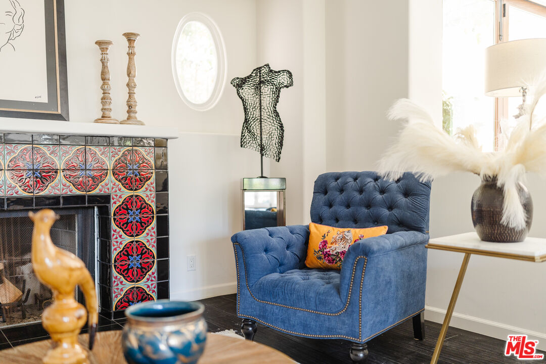 1636 Queens Road Los Angeles, CA 90069 - Photo 3 of 50 a living room with blue lights with furniture and wall paintings