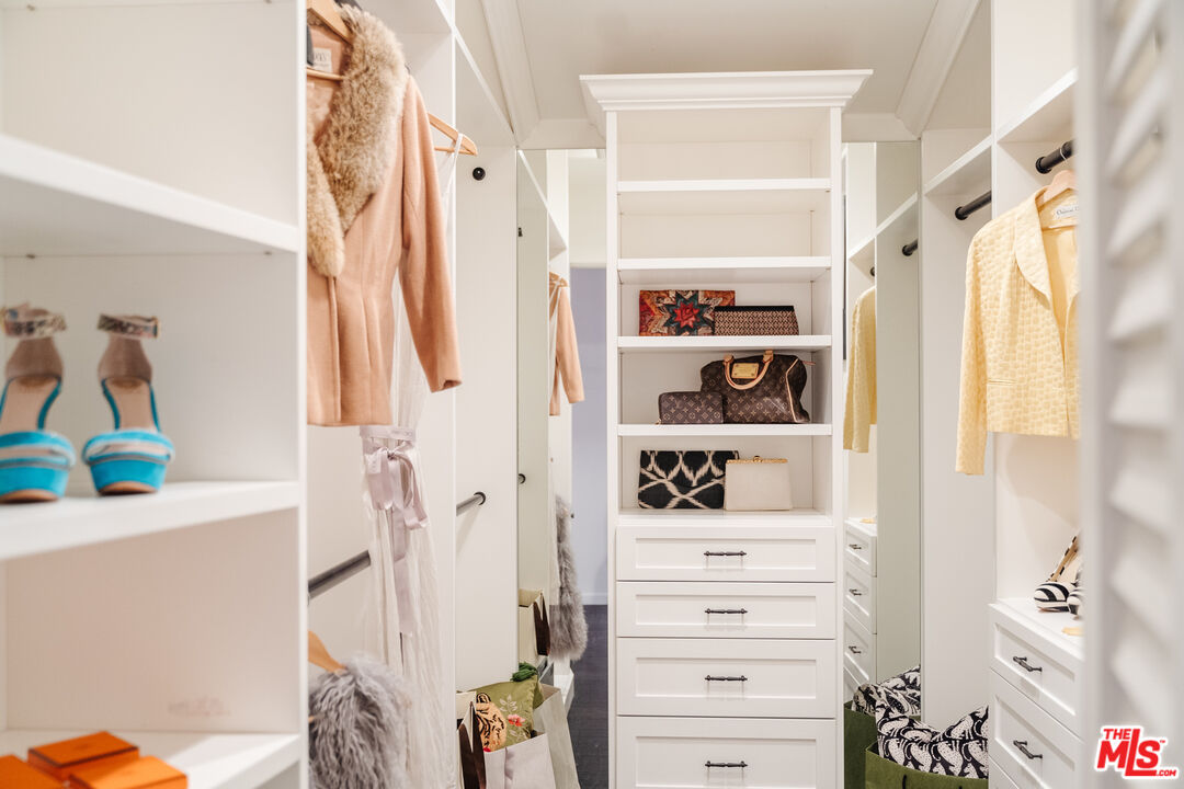 1636 Queens Road Los Angeles, CA 90069 - Photo 22 of 50 a view of walk in closet with clothes and shoes