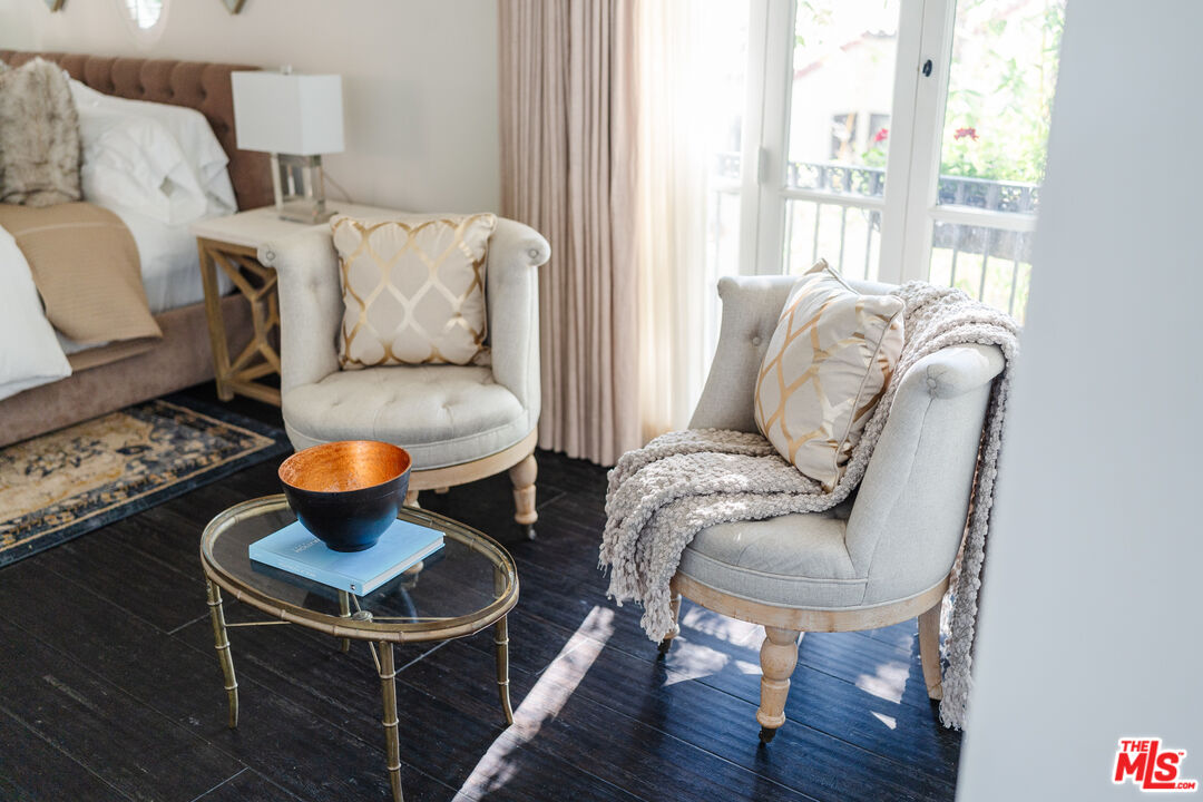 1636 Queens Road Los Angeles, CA 90069 - Photo 31 of 50 a living room with furniture a table and a large window