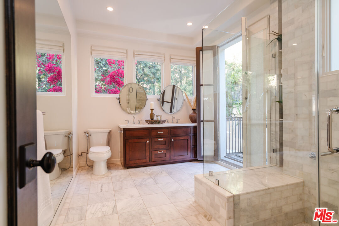 1636 Queens Road Los Angeles, CA 90069 - Photo 32 of 50 a spacious bathroom with a granite countertop tub sink and mirror