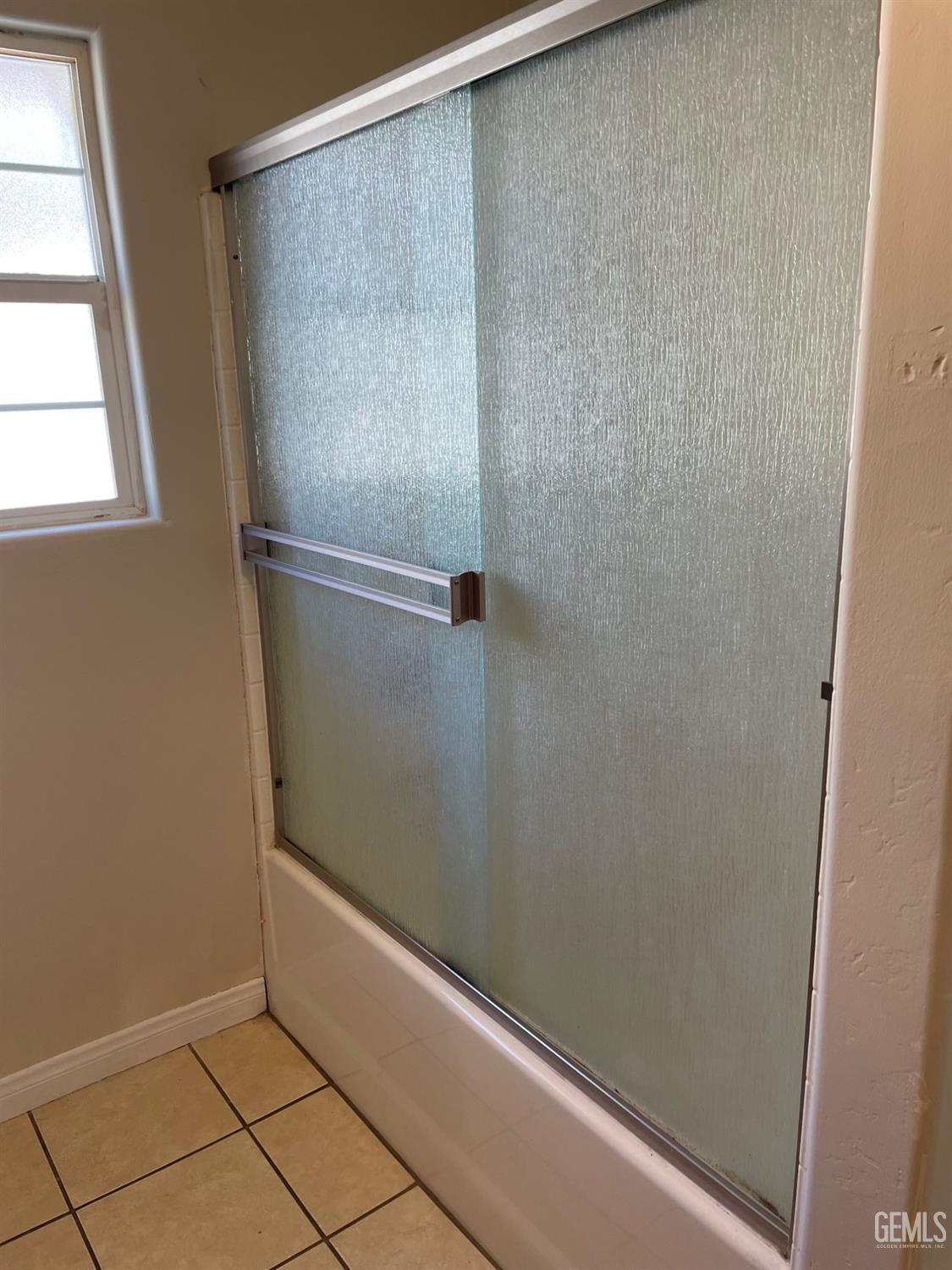 Undisclosed Address Bakersfield, CA 93307 - Photo 16 of 20 a bathroom with a bath tub