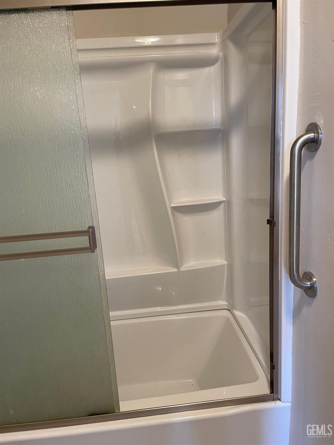 Undisclosed Address Bakersfield, CA 93307 - Photo 18 of 20 a bathroom with a bathtub