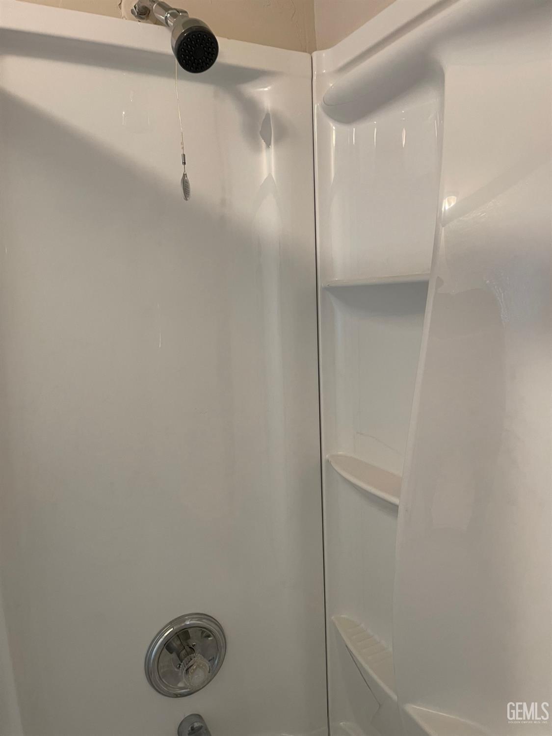 Undisclosed Address Bakersfield, CA 93307 - Photo 19 of 20 a bathroom with a shower