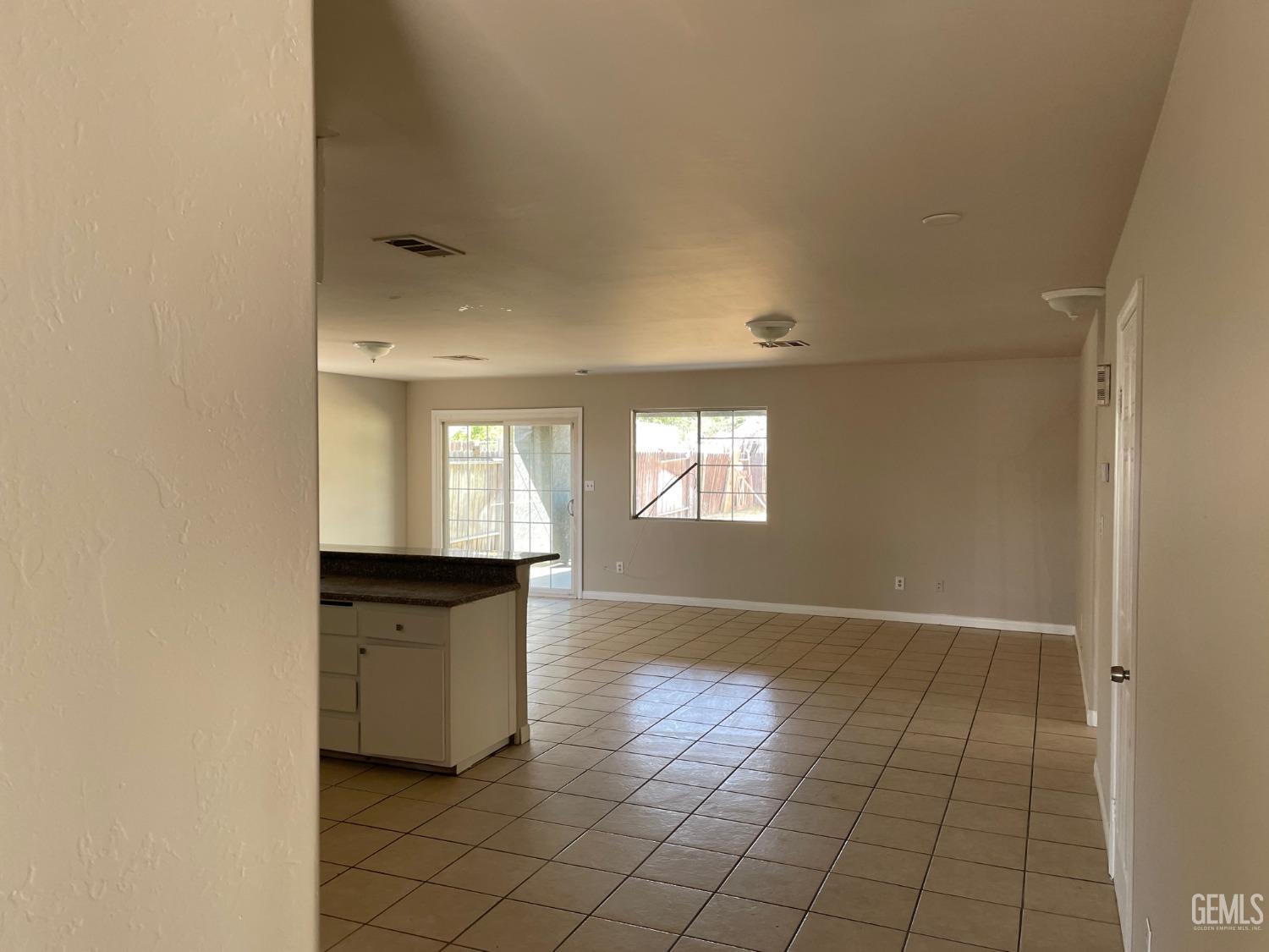 Undisclosed Address Bakersfield, CA 93307 - Photo 10 of 20 a view of an empty room and window