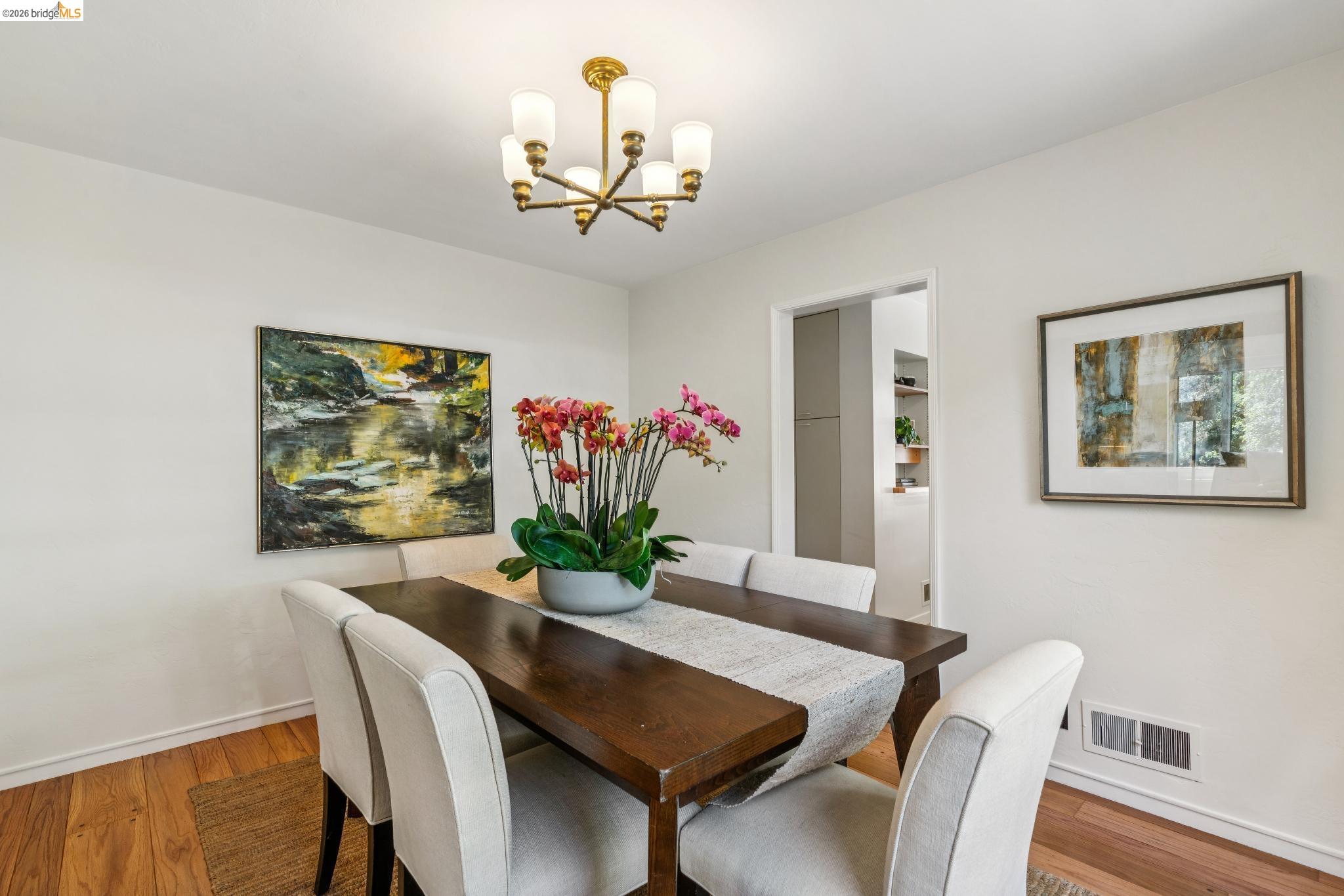890 Keeler Avenue Berkeley, CA 94708 - Photo 14 of 39 a view of a dining room with furniture and a potted plant