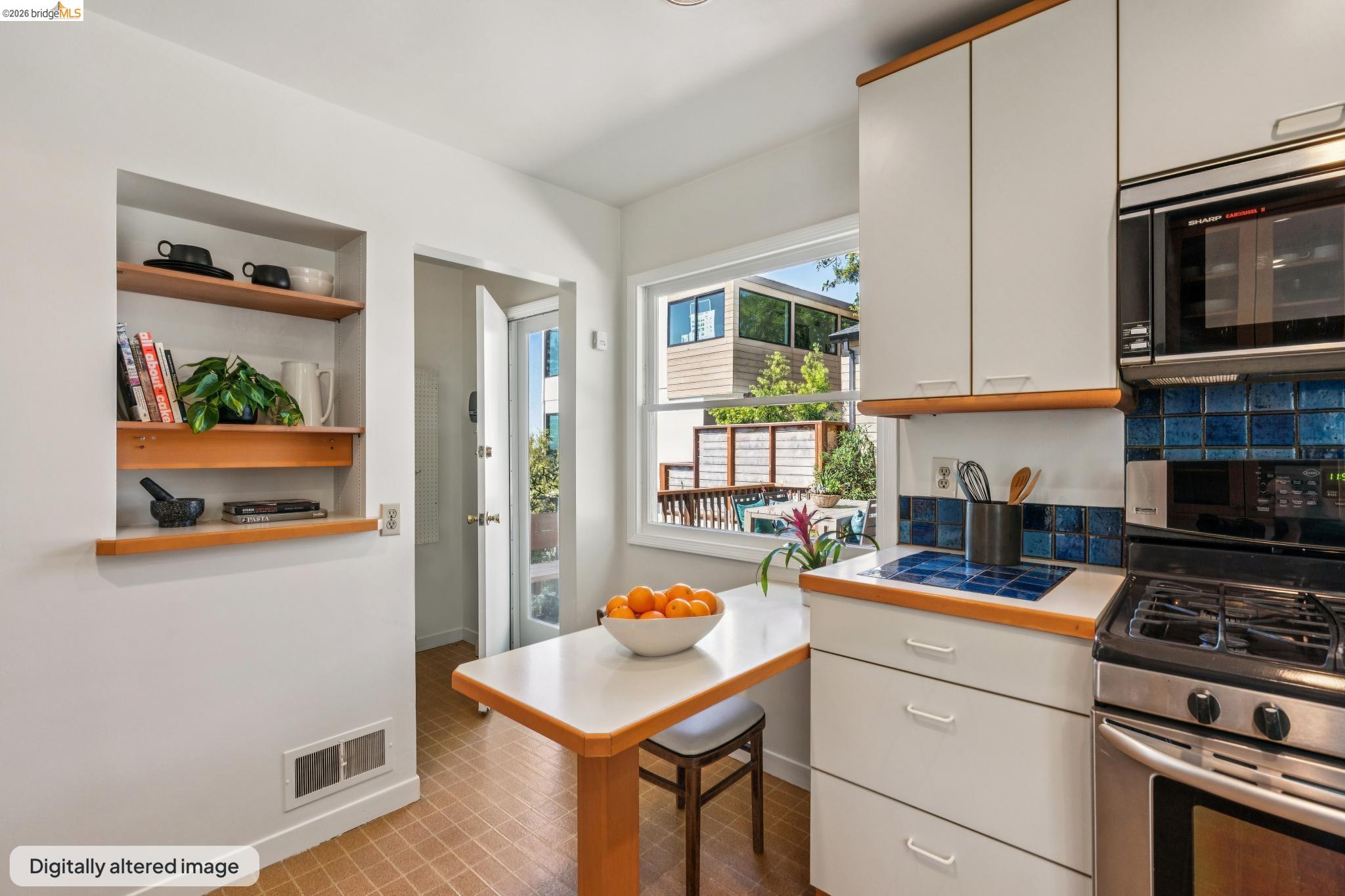 890 Keeler Avenue Berkeley, CA 94708 - Photo 20 of 39 a kitchen with a stove and a microwave