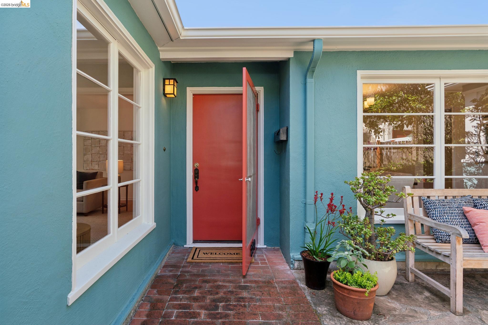 890 Keeler Avenue Berkeley, CA 94708 - Photo 4 of 39 a view of front door of house and potted plant
