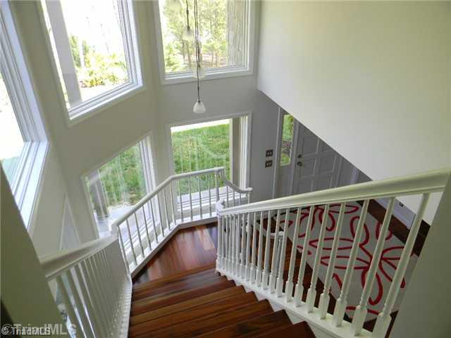 7562 Hampton Road Clemmons, NC 27012 - Photo 11 of 11 Other. Elegant staircase surrounded by windows.