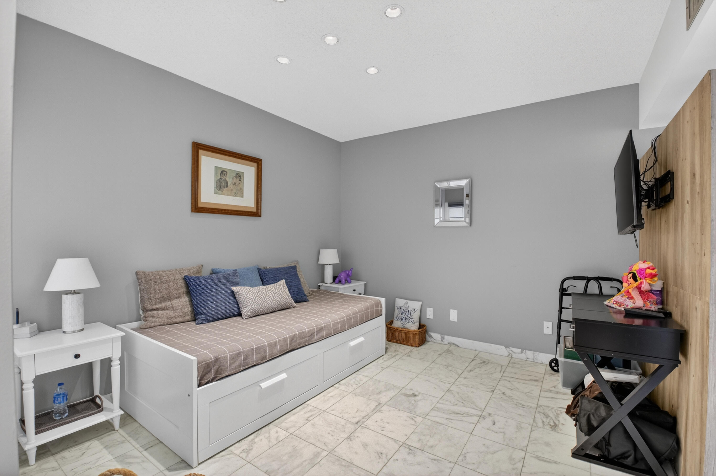 7369 Orangewood Lane, Unit 307 Boca Raton, FL 33433 - Photo 16 of 37 a living room with furniture and a flat screen tv