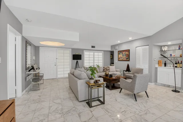 a living room with furniture and a table